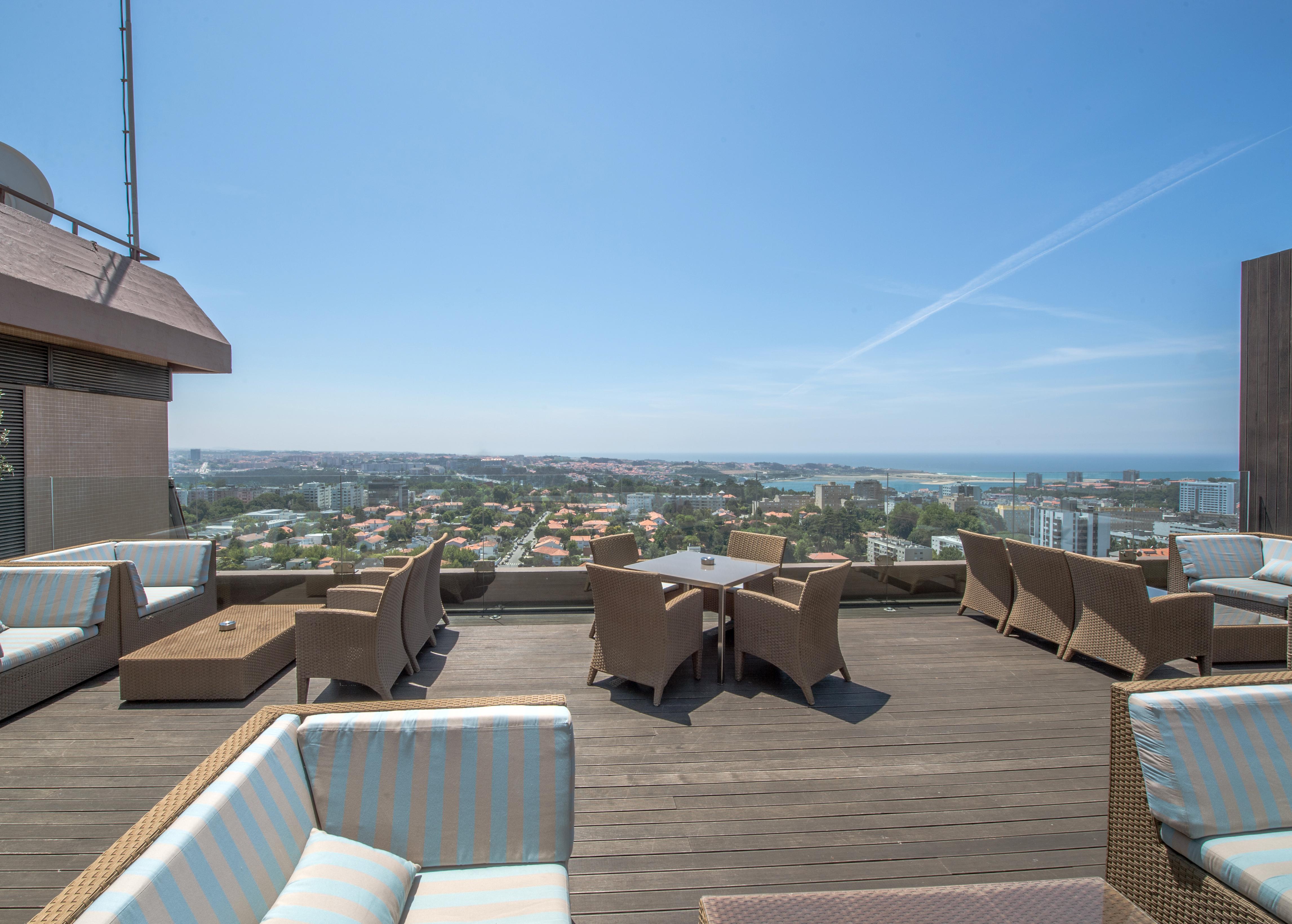 Porto Palacio Hotel By The Editory Exterior photo The rooftop lounge at the Beverly Hills Hotel